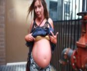 pregnant street-Showing off the belly in a bikini top from showing off the