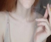 redhead girl smokes a cigarette from siberian moue